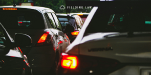 cluster of cars on a roadway after a crash