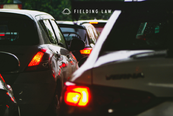 cluster of cars on a roadway after a crash