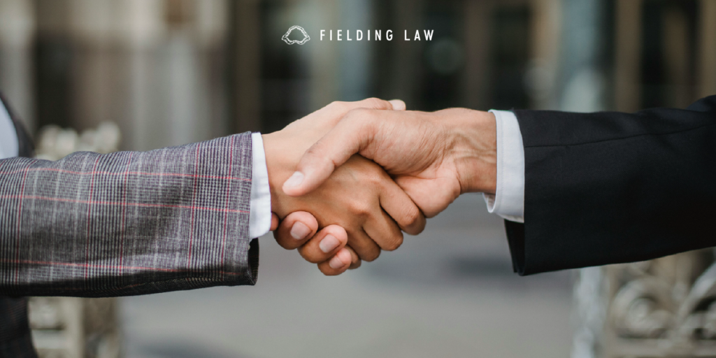 two people shaking hands