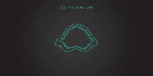 Fielding Law jaw logo on black background