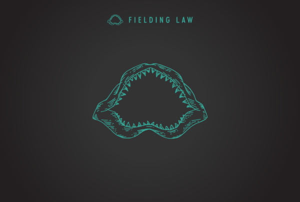 Fielding Law jaw logo on black background