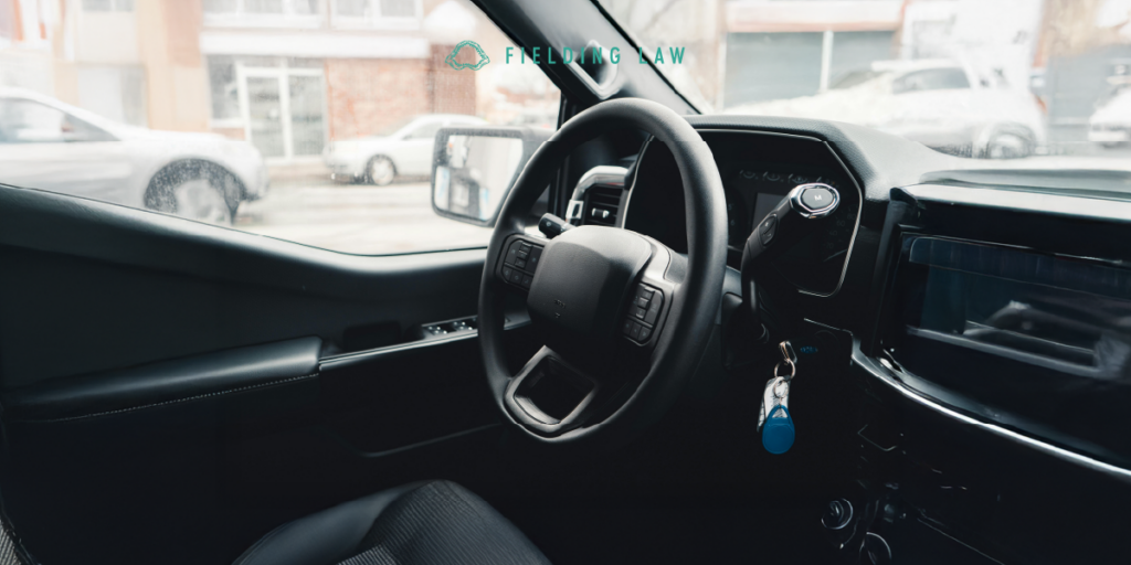 inside a rental car looking at the steering wheel