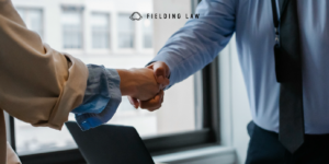 An Attorney shaking hands with a client
