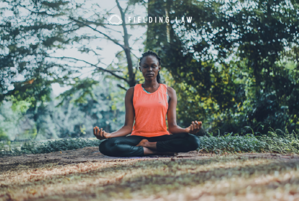 Woman sitting in the woods meditating
