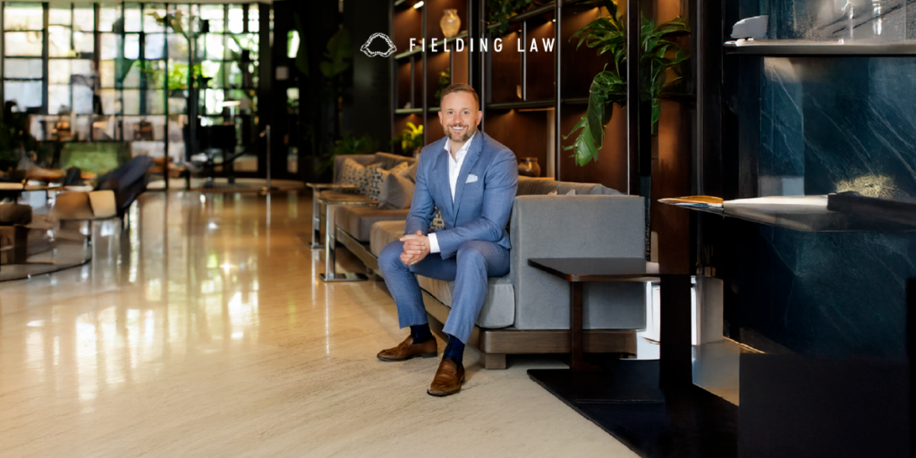 Clark Fielding sitting on a sofa for Top Lawyers