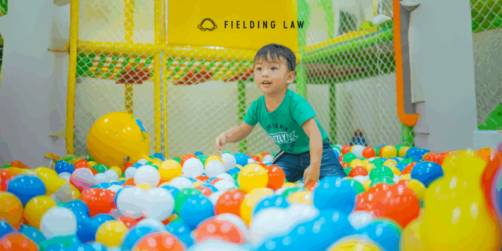 Young boy playing in a ball pit play place