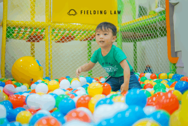 Young boy playing in a ball pit play place