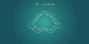 Fielding Law Jaw logo on blue and aqua green gradient