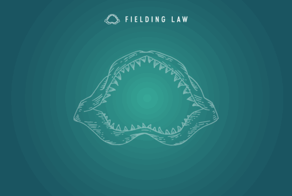 Fielding Law Jaw logo on blue and aqua green gradient