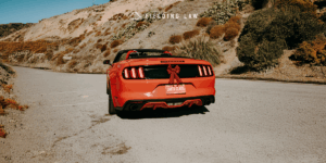red car decorated for a christmas road trip