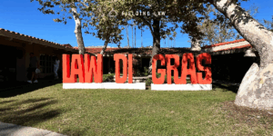 Law-Di-Gras sign in a yard