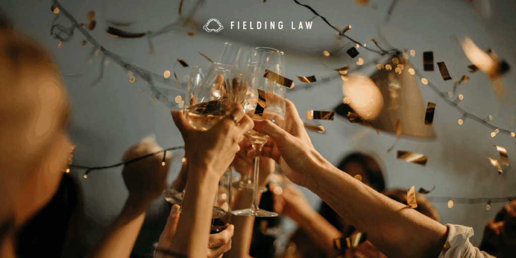 People Toasting Wine Glasses at a New Year's party