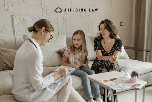 Brain doctor speaking with a child and parent