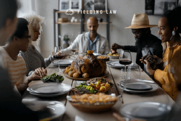 People sitting at a table for thanksgiving food