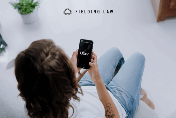 person looking at Uber app in phone