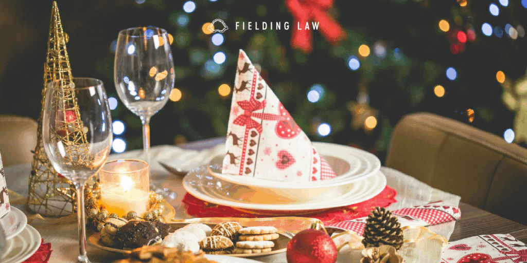 holiday decor on a table with glasses and plates