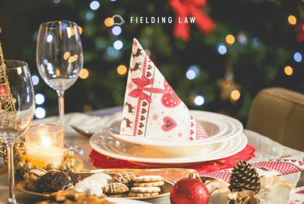 holiday decor on a table with glasses and plates