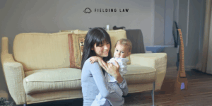 Babysitter with a child in a family room