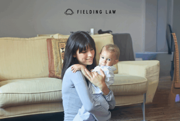 Babysitter with a child in a family room