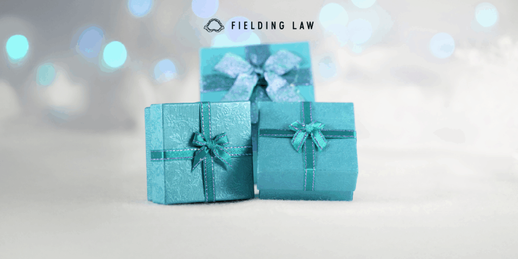 3 teal colored gift boxes