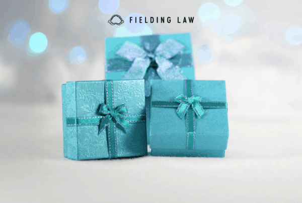 3 teal colored gift boxes