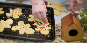 person baking christmas cookies in the kitchen