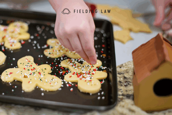 person baking christmas cookies in the kitchen