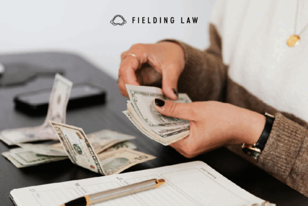 Person counting money from health insurance benefits