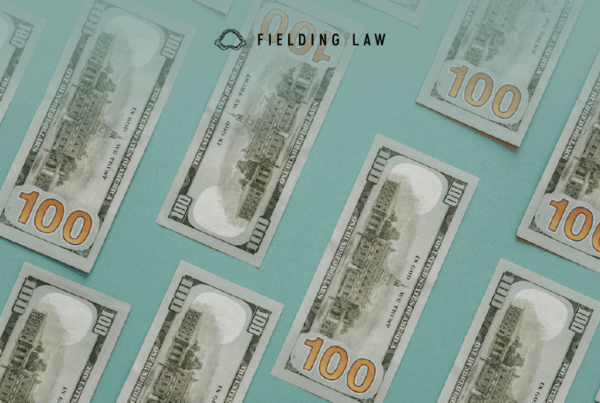 settlement money on a blue table top