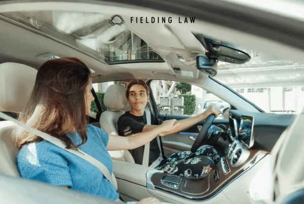 student driver in a car with parent