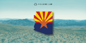 Arizona state flag in the shape of arizona on an Arizona desert landscape