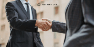 injury attorney shaking hands with a client