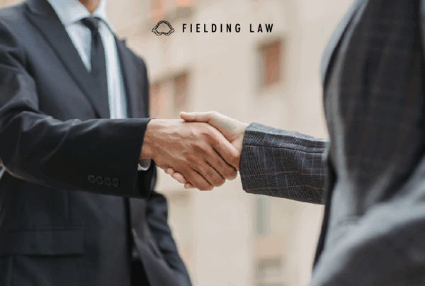 injury attorney shaking hands with a client