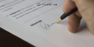person signing a release agreement form