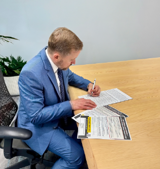 Clark Fielding signing ballot initiative