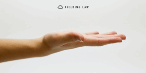 a hand extended out. flat palm up