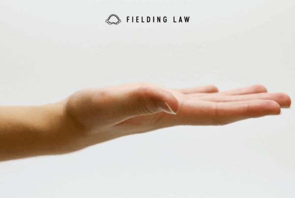 a hand extended out. flat palm up