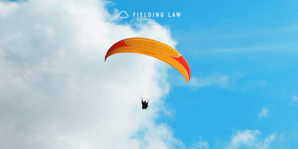 View of the sky with a person using a parachute