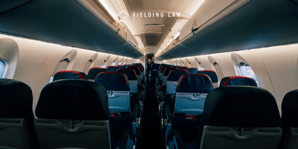 interior view of an airplane looking down the aisle