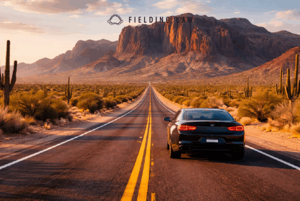 Car driving on an arizona road with cactus
