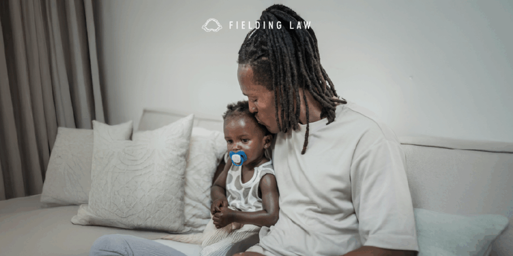 Parent and child sitting on a sofa