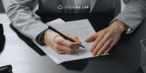 person signing a release form