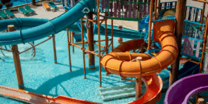 Water park slides leading to a pool
