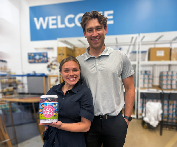 Alyssia from Fielding Law team holding a joy jar