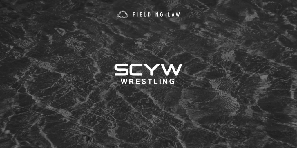 San Clemente Youth Wrestling logo on gray water texture